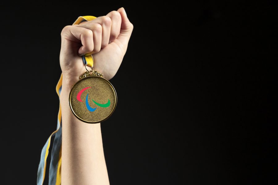 Athlete holding gold medal closeupv2