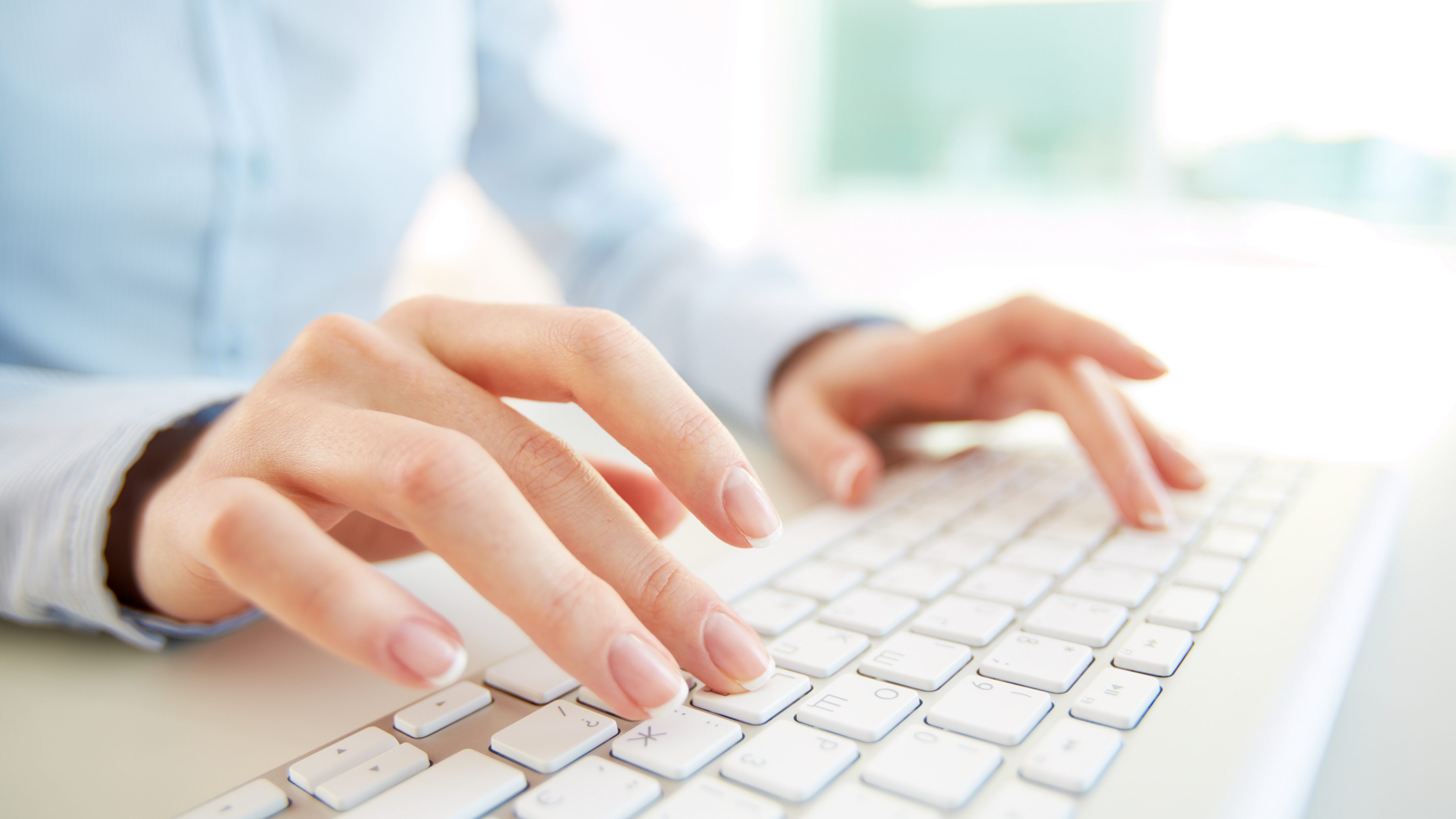 Close up employee with computer keyboard